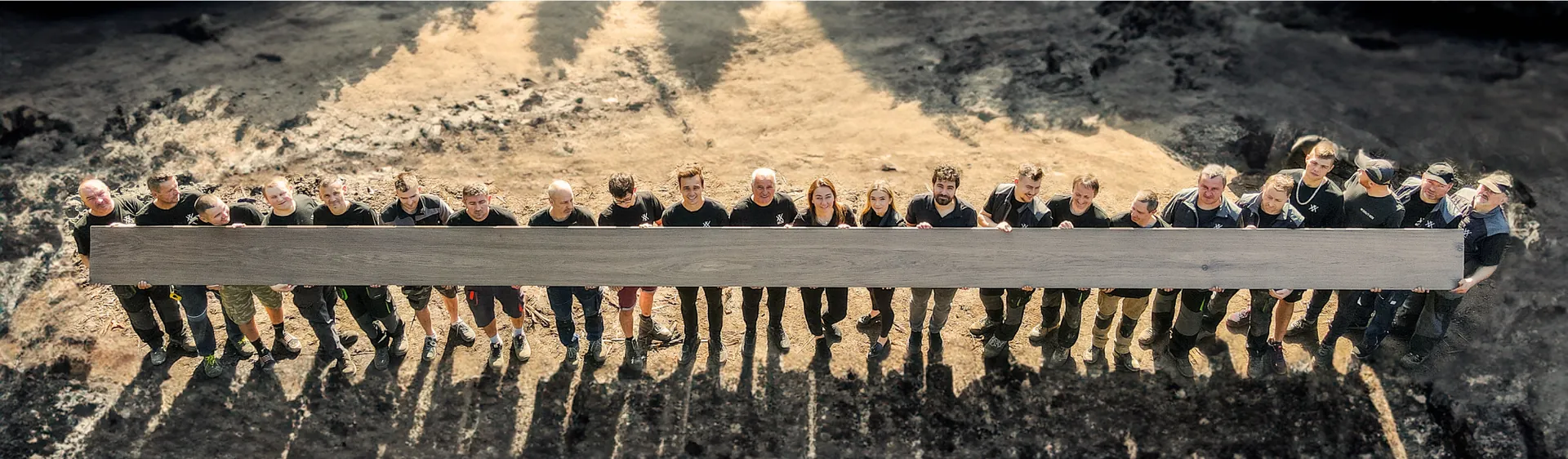 The Duraj's Wood team holding one long board