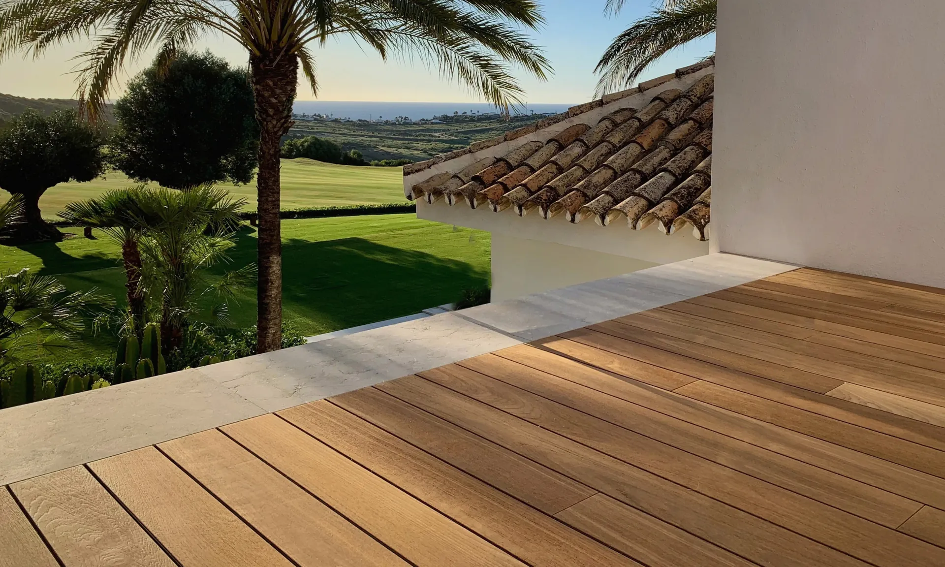 A Teak terrace overlooking a garden