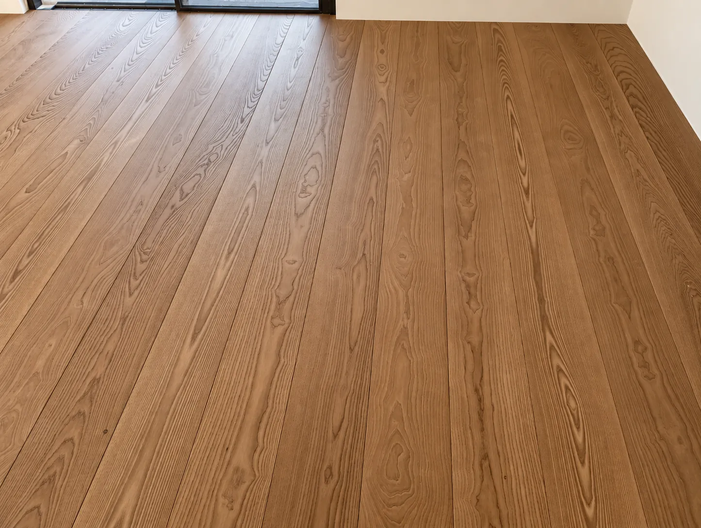 Wide Thermo Ash floorboards in an interior in Piotrkowice